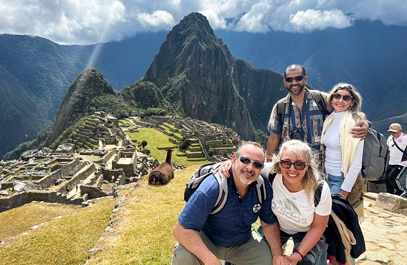 Group of friends exploring the ruins of Machu Picchu