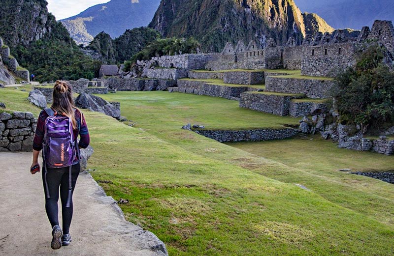 Tourist touring the archaeological site of Machu Picchu