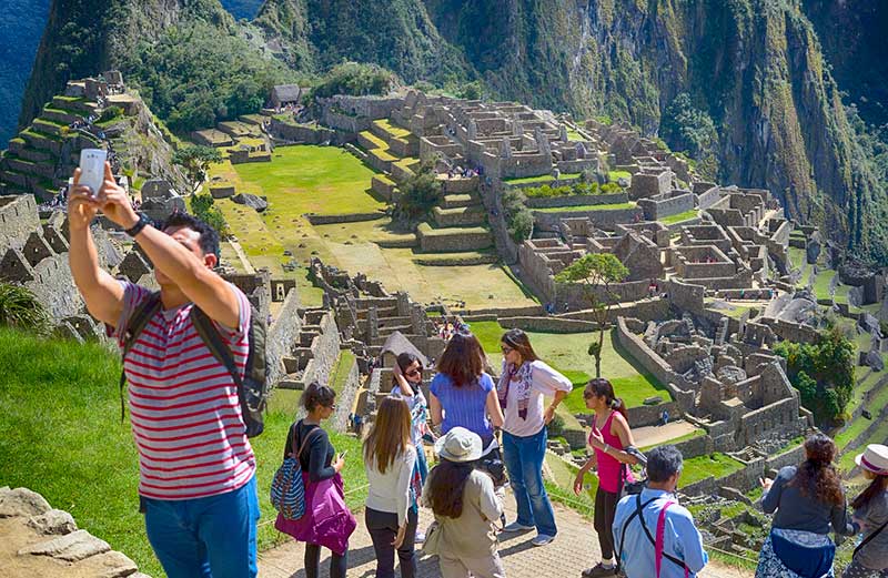 Traveler taking a selfie in Machu Picchu