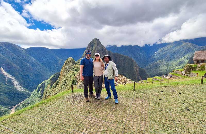 Tourists taking the classic photo at Machu Picchu
